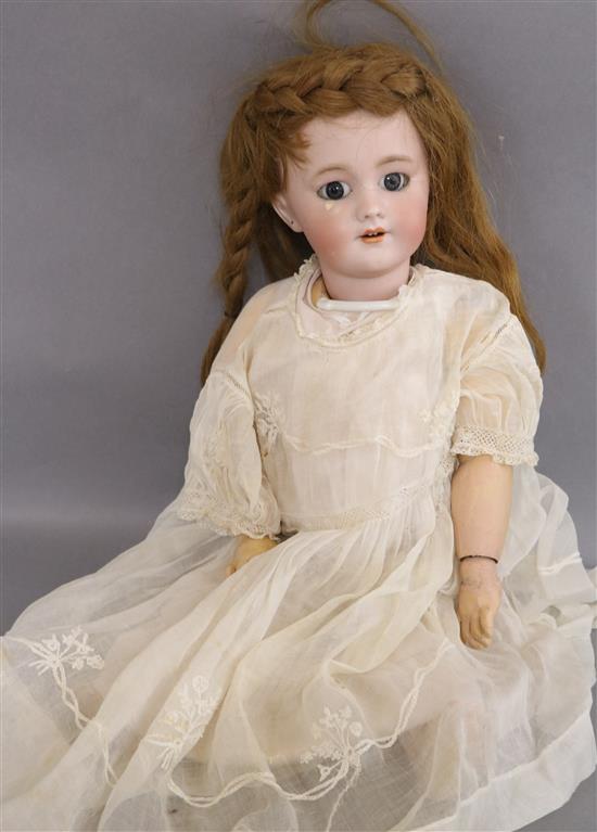 A Tete Jumeau doll on stand approx. length 48cm